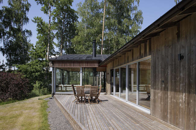 Terrace of an L-shaped wooden house