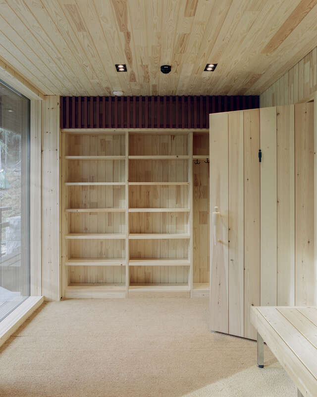 Wooden interior with shelves along the back wall.