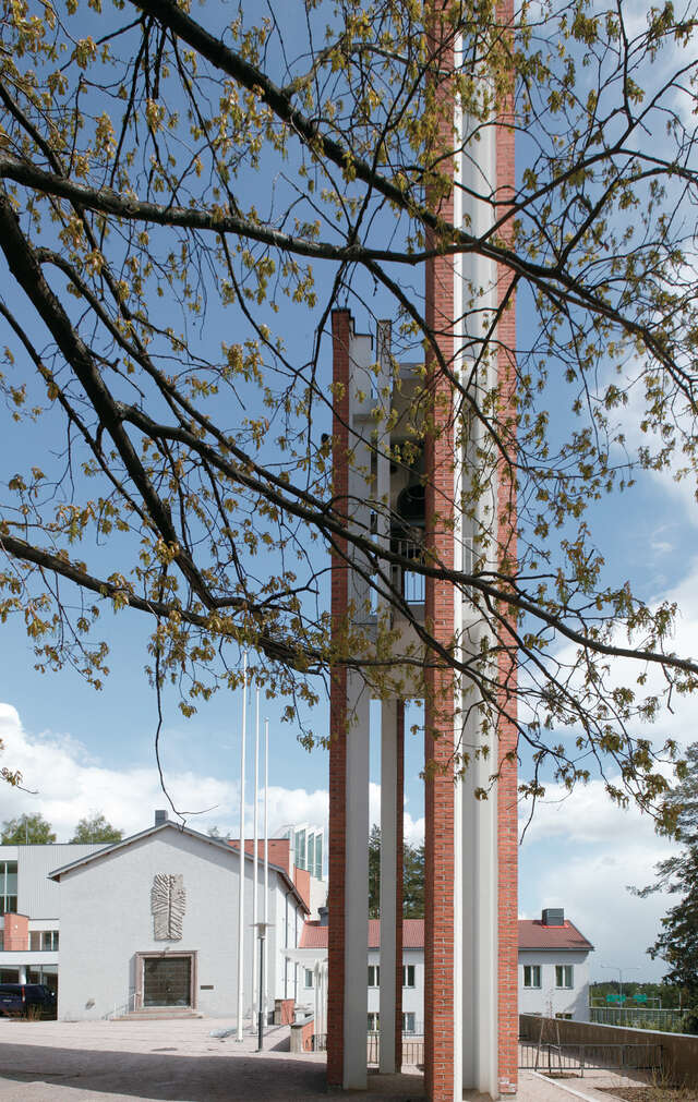 Red.tile and white plastered bell tower.