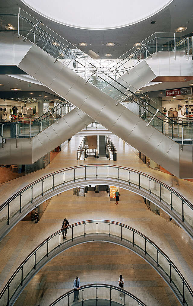 View of the different stories wit their glass railings.