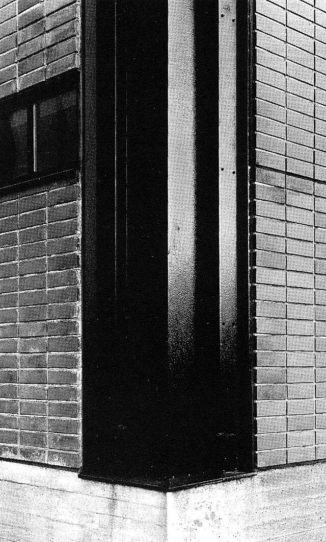 Corner of the façade with dark steel-clad surface