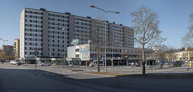 High-rise apartment block of eleven floors and annexe of three floors for commercial premises.