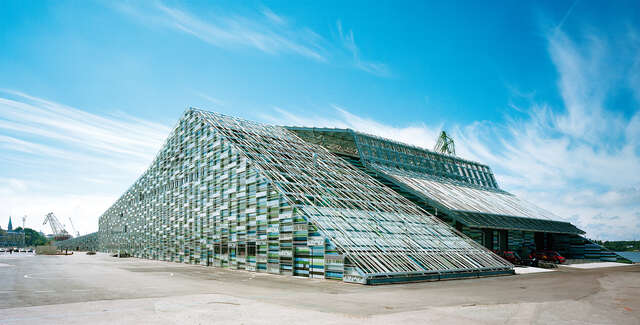 Building exterior with different colored glass panels.