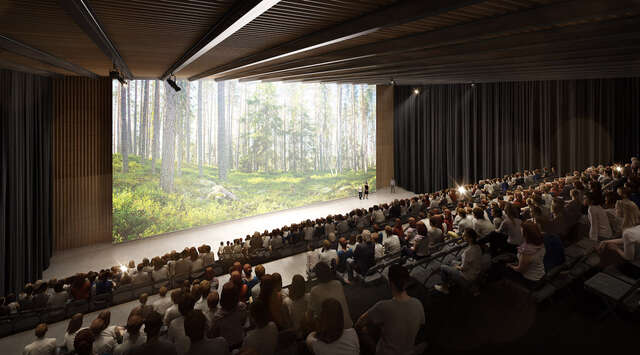 Presentation hall with people sitting.