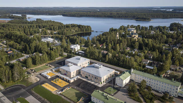 Aerial picture of the Tuupala school an its green surroundings near the sea.
