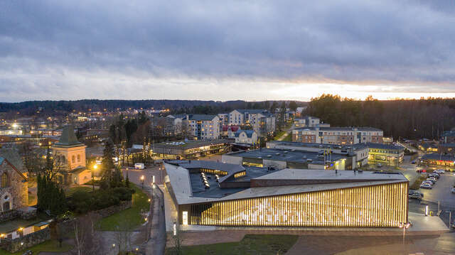 Aerial view, library in front, medieval church on left, town centre behind