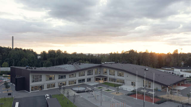 Aerial photo of the whole building and the front yard.