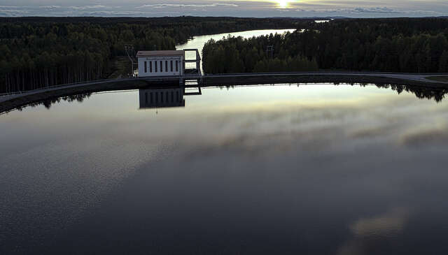Photo of the hydropower plant from bird eye view in the middle of the wilderness.