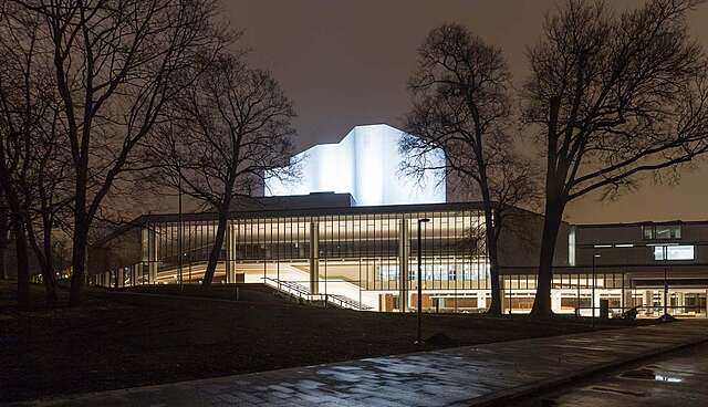Illuminated building at dark.
