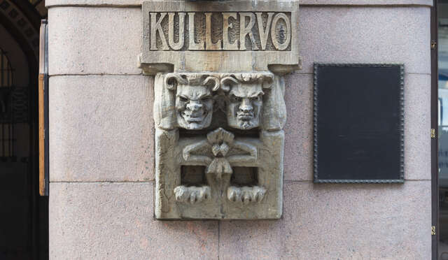 Sculpture with two faces and talons.