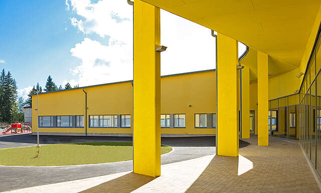 Bright yellow facade on a sunny day.