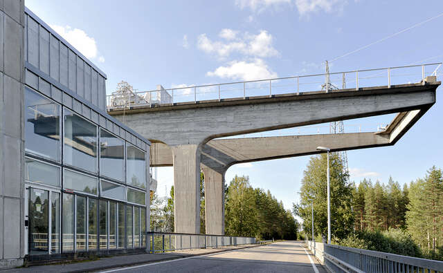Concrete crane frame captured on the bridge that spans over the river.