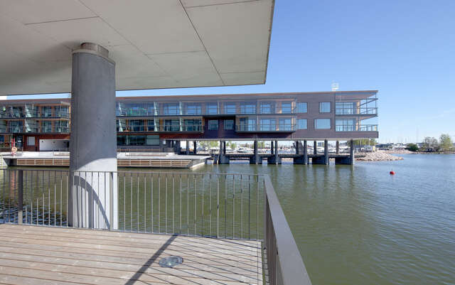 Two modern apartment buildings built on docks with direct access to the sea.