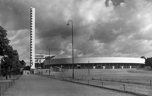 Entrance way to the stadium with the tower on the far left and the stadium curve in the middle