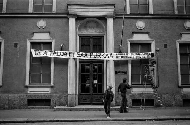 A banner on an entrance of an old school building