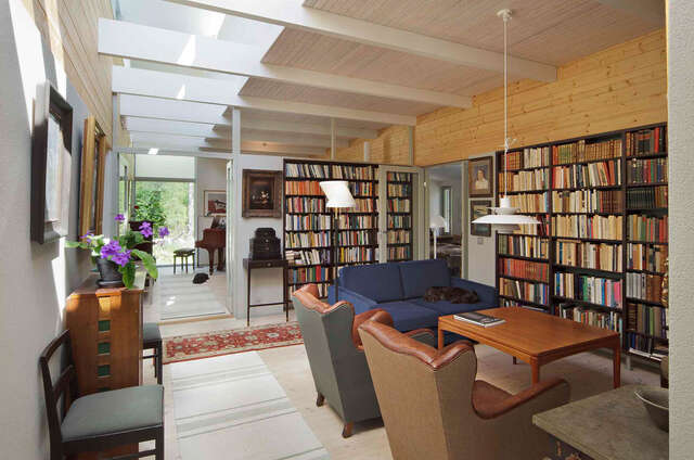 Library view with sitting group, ceiling lights and books