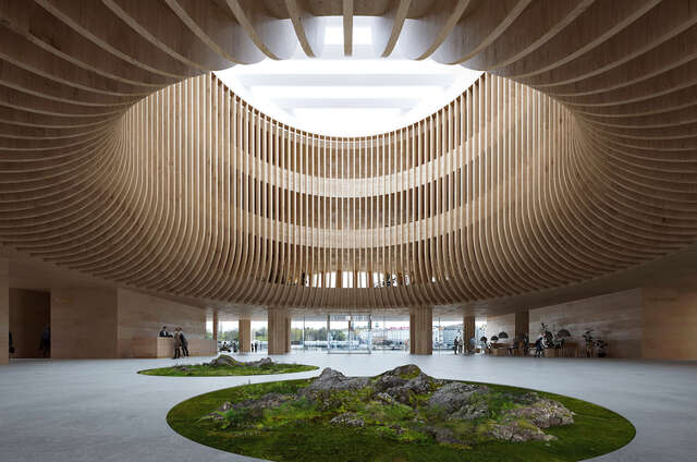 Main lobby with large wooden structure above and skylight.