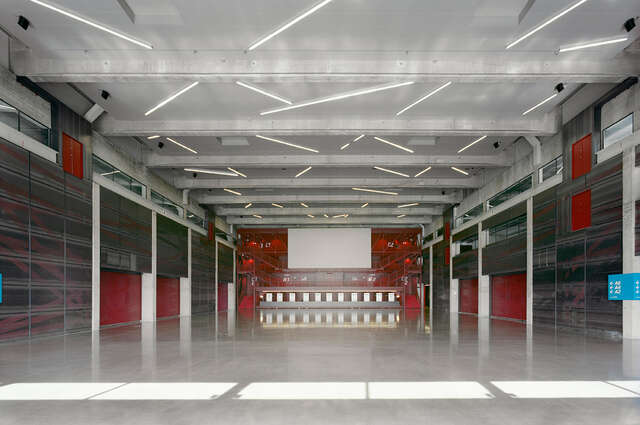 Industrial interior with red, grey and light elements