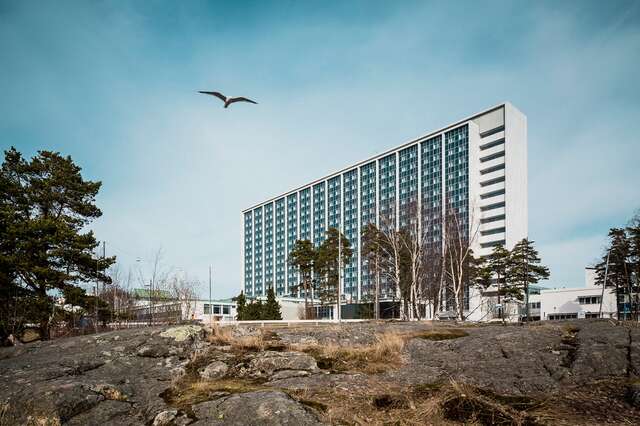 Hospital building on outcrop.