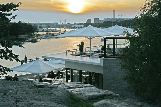 View from a rock over the terrace cafe , city silhouette in the background