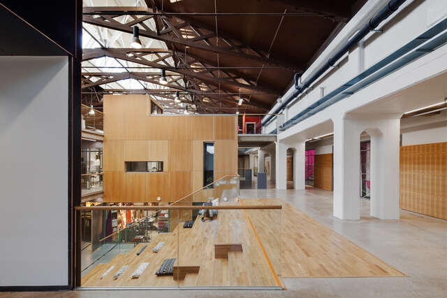 Wooden wall and stair element inside an industrial interior