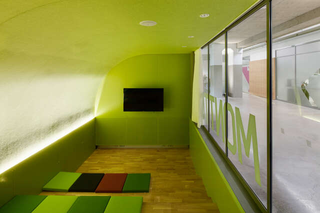 Glazed green room with mattresses and display