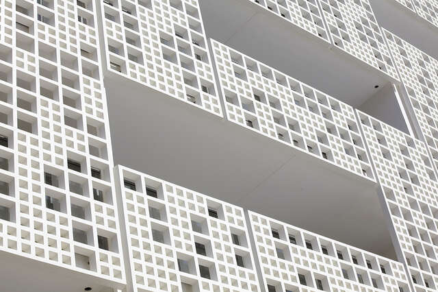 Close up shot of the white grid details on the balconies.