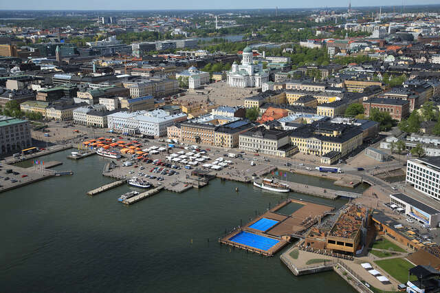 Aerial view of the Allas sea pool and the city centre around it.