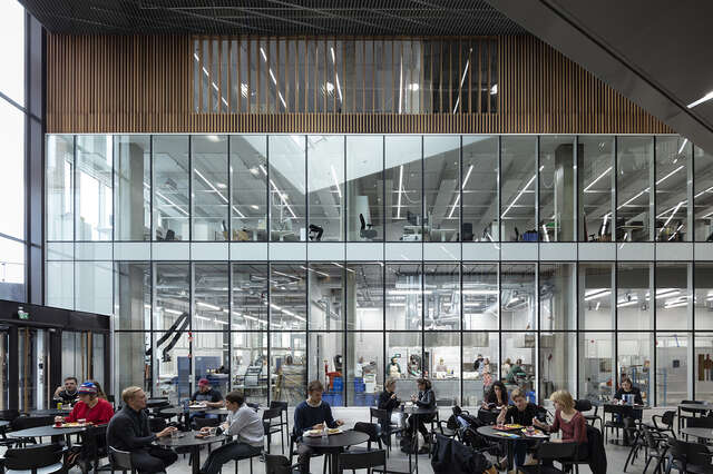 Glass wall, people in a lecture hall