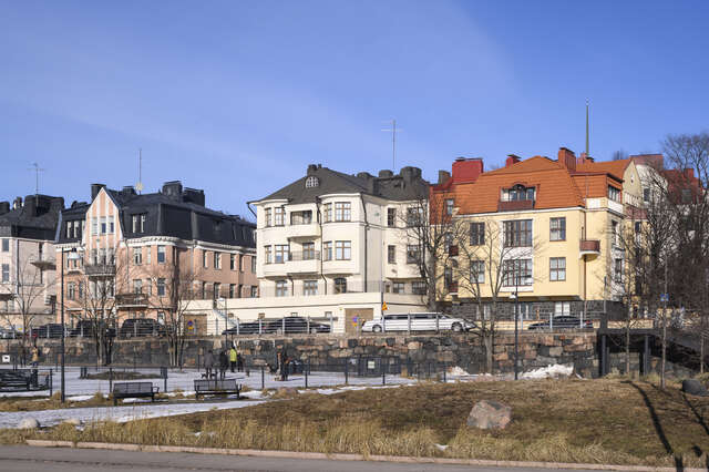 Villas behind a public park.