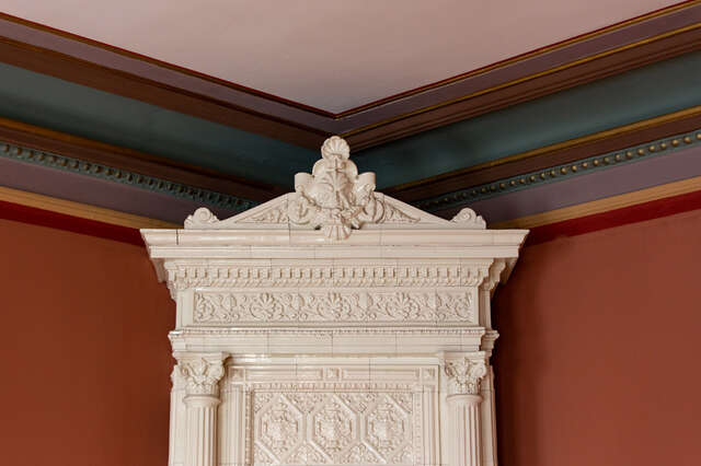 Ornate porcelain fireplace details.