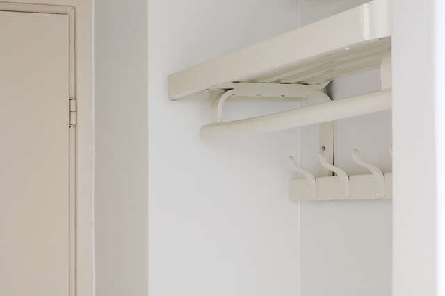 White coat arch next to the door.