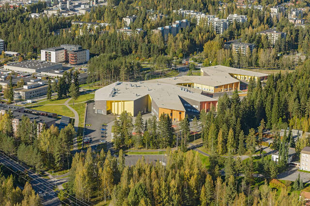 Colorful walls of the school towards the forest.