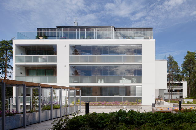 White building with glass balconies