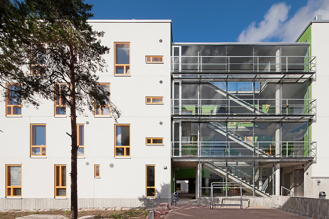 A white building with glass walls.