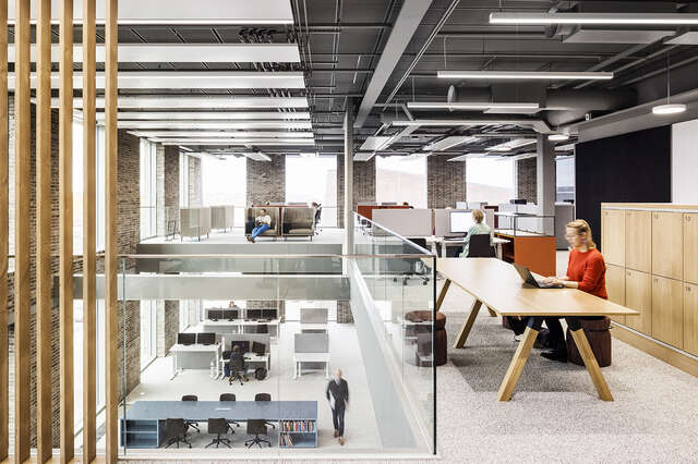 Open office spaces next to an atrium space