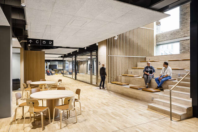 Lobby with wooden floor and sitting stairs