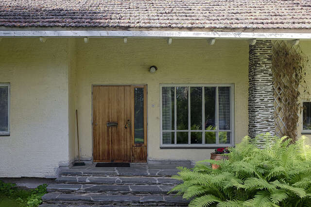 photo of the façade of a residential house's entrance