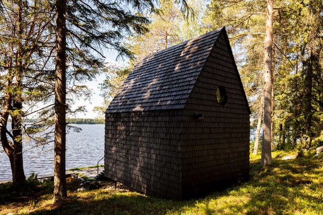 Back side of a shingle-covered hut