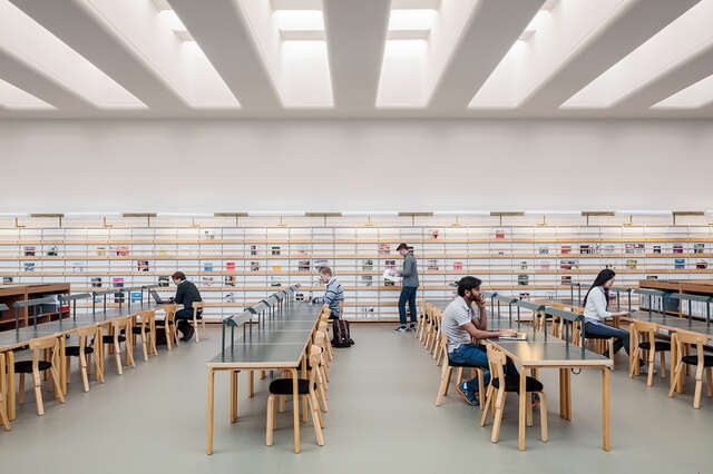 Rows of tables in a magazine hall.