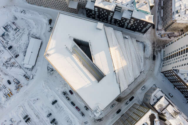 A large wooden structure covered in snow