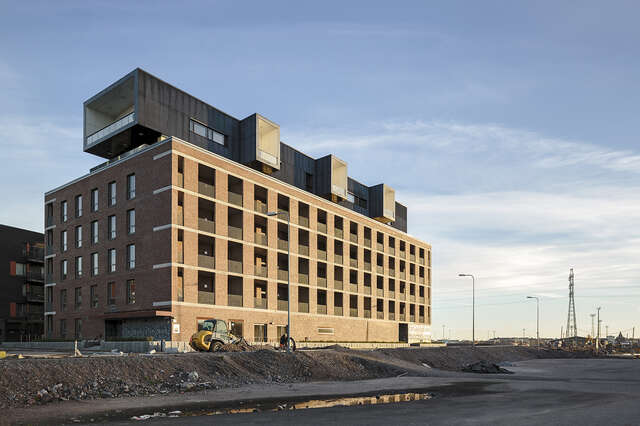 Red-brick building in an industrial environment.