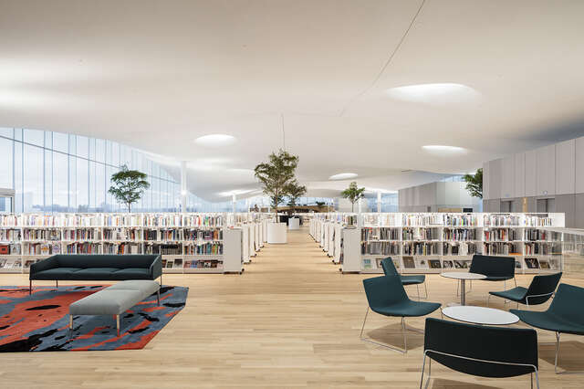 Comfortable interior of the library with bookshelves and seating arrangements.