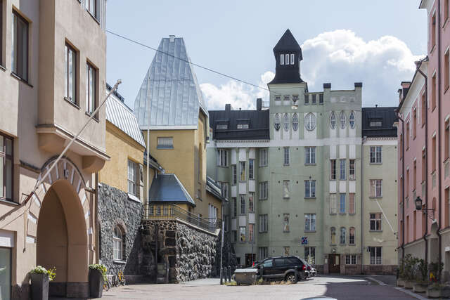 Pastel colored buildings at the end of the street.