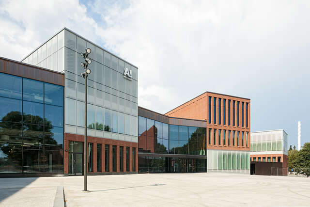 Empty square, red brick and glass building