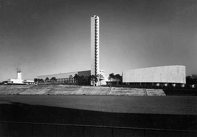 Lawn and auditorium in front of the stadium rising in the horizont