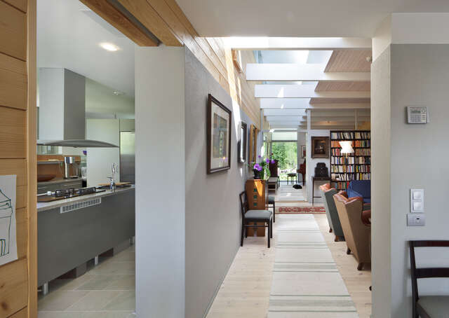 View through a villa from a library to a window with a garden