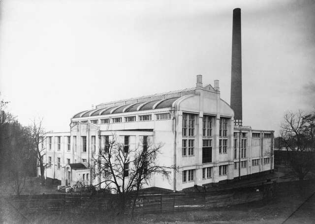 White power plant building pictured from the side