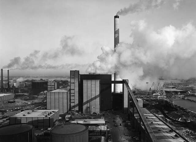 Power plant area with big smoky clouds