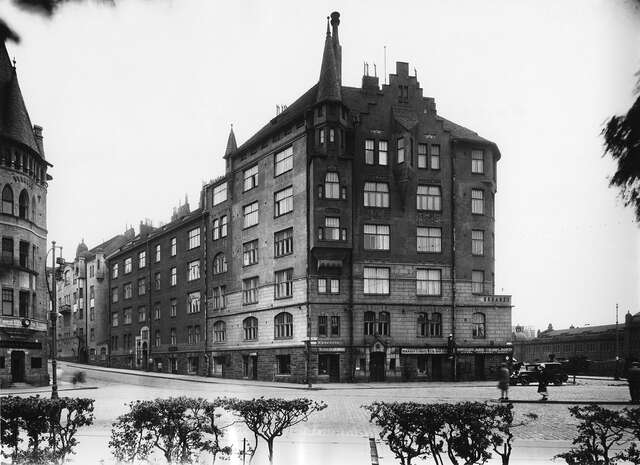 Black and white picture of the multiple storey building facade.